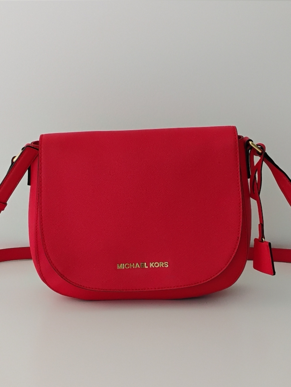 Michael Kors Hamilton Messenger bag in red saffiano leather featuring gold-tone